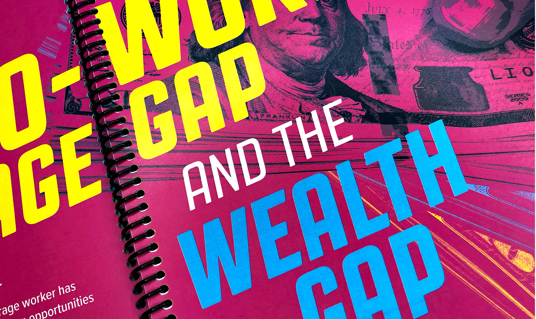 Close-up of book spread with photocollage expressing the wage gap